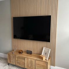 a flat screen tv mounted to the side of a wall