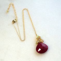 "The 20mm ruby pendant is table faceted, full of glow and rich color and has intense polish and sparkle. It hangs beneath a cluster of reflective rainbow Ethiopian opals. The length is a very flattering 17\" - 19\" long - adjustments can be made, please inquire. An absolute one and only piece, don't miss out. Pair this with any of my ruby earrings!" Ruby Briolette Gemstone Jewelry, Elegant Faceted Ruby Gemstones, Elegant Natural Ruby Gemstones, Black Diamond Pendant, Ethiopian Opal Necklace, Ruby Necklace Pendant, Ruby Pendant, Ruby Earrings, Diamond Pendant Necklace