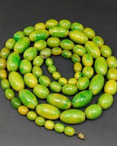 152.5 Grams Antique Bakelite Beads Necklace With Marbled. Very good condition. 68 total beads,all marbled. Yellow color with green veins. Biggest size bead 27.33 mm x 15.35 mm Smaller size bead 10.75 mm x 9.15 mm Length - 120 cm. Vintage Green Oval Bead Necklaces, Vintage Green Oval Beaded Necklaces, Vintage Green Oval Beaded Necklace, Vintage Green Beaded Necklace With Oval Beads, Vintage Green Beaded Necklaces With Oval Beads, Green Polished Beads For Jewelry Making, Green Oval Beads For Jewelry Making, Polished Green Jade Beads, Green Polished Jade Beads