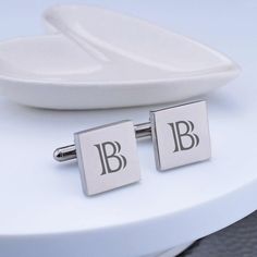 These classicaclly customized cufflinks are a great gift for any man. They look great on the groom, groomsman, or father of bride or groom! Each cufflink is engraved with a single initial. CUSTOM ENGRAVING: BOTH CUFFLINKS: [Initial] DETAILS: MATERIAL: stainless steel SHAPES: round or square FINISHES: gold, gunmetal, rose gold, stainless steel DIMENSIONS: 5/8 inch Elegant Engraved Cufflinks For Business, Elegant White Gold Cufflinks As Gift, Elegant Engraved Cufflinks, Luxury Rectangular Cufflinks For Wedding, Elegant Engraved Cufflinks For Anniversary, Classic Rose Gold Cufflinks For Formal Occasions, Timeless Silver Cufflinks For Wedding, Modern Initials Jewelry For Formal Occasions, Elegant Rectangular Cufflinks For Father's Day