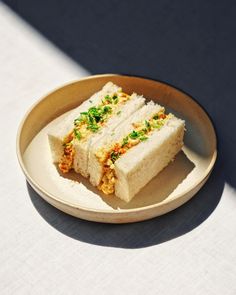 two pieces of cake sitting on top of a white plate