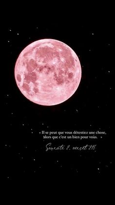 a pink moon in the night sky with a poem written on it's side