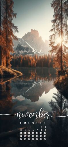 a calendar with the words november written on it in front of a lake and mountains