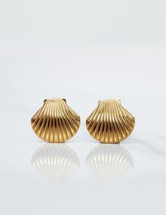 Indulge in luxury with our Ocean's Dollars Chunky Seashell Stud Earrings. Crafted with beautiful seashells, these earrings are a statement piece that exudes elegance and sophistication. Elevate any outfit and channel a beachy vibe with these unique and exclusive earrings. Waterproof & Tarnish Free Materials All our jewellery is Nickel Free & Hypoallergenic with premium double 18k Gold Plating on Stainless steel.  -Base metal: Stainless Steel -PVD Plated: 18K Gold Gold Shell-shaped Jewelry With Matching Earrings, Single Shell-shaped Gold Earring, Elegant Shell-shaped Gold Plated Earrings, Elegant Gold-plated Shell-shaped Earrings, Elegant Gold Shell-shaped Jewelry, Gold Shell-shaped Jewelry For Formal Occasions, Gold Jewellery For Women, Beautiful Seashells, Exclusive Earrings