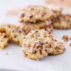 some cookies are sitting on a white surface