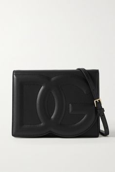 Dolce & Gabbana's bag has been made in Italy from sleek black leather and has a slim, structured silhouette with the label's embossed monogram at the front. It comes with a detachable shoulder strap, so you can wear it cross-body or as a clutch on nights out. The interior fits your phone, cardholder and lipstick for touch-ups. Designer Crossbody Bag With Embossed Logo, Designer Shoulder Bag With Embossed Logo, Luxury Rectangular Shoulder Bag With Embossed Logo, Luxury Evening Shoulder Bag With Embossed Logo, Designer Crossbody Bag With Logo Plaque, Leather Evening Bag With Logo, Luxury Leather Bag With Embossed Logo, Evening Leather Bags With Logo, Evening Leather Bag With Logo