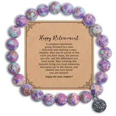 a purple and blue bracelet with the words happy retirement written on it, in front of a