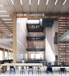 the interior of a library with tables and chairs