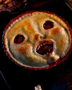 a pie with two faces made out of it