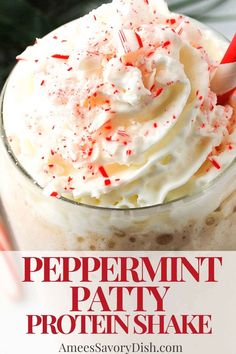 peppermint patty protein shake in a glass with whipped cream and sprinkles