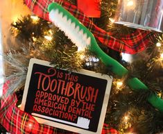 a christmas tree with a toothbrush sign on it