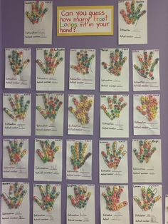 a bulletin board with many different handprints on it