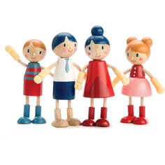 a group of wooden dolls standing next to each other