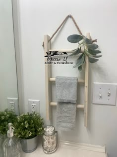 a bathroom sink with a towel rack hanging on the wall