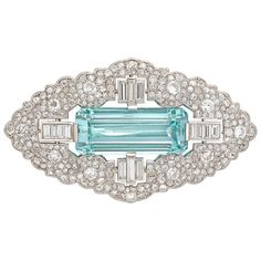 An Art Deco aquamarine and diamond brooch, the emerald-cut aquamarine weighing 27 carats between four sections set with baguette-cut diamonds, all surrounded by a Mughal-style design frame, set with old European and swiss-cut diamonds, the diamonds estimated to weigh 11 carats in total, all mounted in platinum, with platinum brooch fitting, circa 1930, measuring 6 x 3.4cm, gross weight 22.2 grams. This brooch is in excellent condition. Unmarked, tested as platinum. A stunning diamond and aquamar White Gold Aquamarine Ring, Bijoux Art Deco, Bijoux Art Nouveau, Art Deco Silver, Antique Brooches, Aquamarine Jewelry, Diamond Brooch, Deco Jewelry, Art Deco Diamond