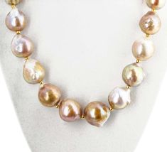 For Sale on 1stDibs - Brightly glowing brilliant goldy ocean cultured pearls ( averaging 18mm round approximately ) set in a 17 inch long necklace with gold plated clasp. Yellow Gold High Luster Round Beads Necklace, Yellow Gold Necklace With High Luster Round Beads, Yellow Gold High Luster Baroque Pearl Necklace, Yellow Gold Pearl Necklace With High Luster Baroque Pearls, High Luster Yellow Gold Pearl Necklace With Round Beads, Formal Gold Baroque Pearl Necklace, Jewelry Making Necklace, Pearls Necklace, Cultured Pearl Necklace