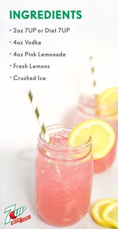 two mason jars filled with pink lemonade and topped with sliced lemons on the side