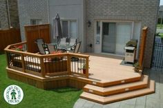 a wooden deck with chairs and an umbrella