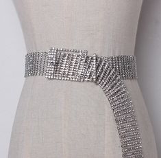 Silver Rhinestone Crystal Extra Long Belt. Glamorous and luxe look in seconds, this extra long crystal buckle belt is a perfect way to embellished your outfit another level. Great and versatile piece, this belt can be also worn over your neck, too! So cool! Gender: WomenItem Type: BeltsStyle: FashionBuckle Width: 3.5cmBuckle Length: 104cmBelt Width: 3cmBelts Material: MetalMaterial: Rhinestone+alloy