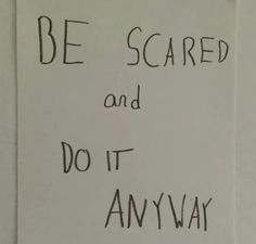 a white sign with black writing on it that says be scared and do it anyway