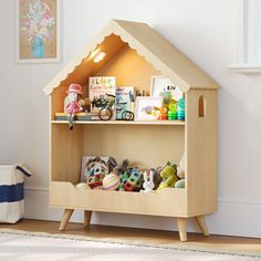 a wooden shelf with toys on top of it