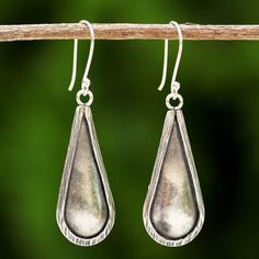 Artisan Chanatip Na Lampoon of Thailand handcrafts these beautiful drop-shaped dangle earrings. The artisan uses 950 silver from the hill tribes of Thailand to create the simple design. Traditional Handmade Sterling Silver Teardrop Earrings, Traditional Nickel-free Sterling Silver Teardrop Earrings, Artisan Sterling Silver Teardrop Dangle Earrings, Silver Drop Artisan Earrings, Artisan Silver Drop Earrings, Artisan Drop Earrings, Artisan Silver Teardrop Earrings, Artisan Teardrop Dangle Earrings With Ear Wire, Artisan Dangle Teardrop Earrings With Ear Wire