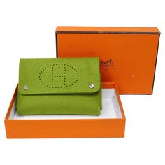 This is a beautiful Hermes clutch bag! This can be used a million ways making it a no-brainer! Originally designed by Hermes to hold playing cards, we have other ideas of how to use this cute pouch. Perfect to hold keys, phone, papers, handkerchiefs, medicines, make-up, coins, card, or whatever you desire! This is features in an anise green soft felt, with 'HERMES PARIS' branded silver-tone button closures, and a perforated 'H'. The perforated 'H' resembles the iconic the "Evelyn" or "Feudou" Hermès style. Get the cutest mini Evelyn today! You won't be able to resist a smile when seeing this green mini accessory. Put this in your Hermes handbag to organize your belongings and wear your favorite Christian Dior heels, Prada skirt, and Vivian Westwood blazer and you are ready for whatever th Christian Dior Heels, Vivian Westwood, Dior Heels, Hermes Clutch, Prada Skirt, Cute Pouch, Hermes Style, Mini Accessories, Green Soft