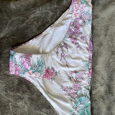 This Bikini Bottoms Are White With Pastel Flowers On Them. They Are Brand New With Tags And The Hygiene Liner. By The Way The Tag On The Inside Is It Is Quite Possible They Are Reversible But Even If They Aren’t Supposed To Be I’m Sure They Would Be Completely Fine Being Reversed To The White Side With The Pattern On The Top Band. White Triangle Top Swimwear For Vacation, White Tropical Tankini For Vacation, White Tropical Tankini For The Beach, Tropical White Tankini For Vacation, White Tankini For Vacation Swimming, White Tankini For Swimming Vacation, White Stretch Swimwear For Vacation, Printed White Tankini For Vacation, White Printed Tankini For Vacation