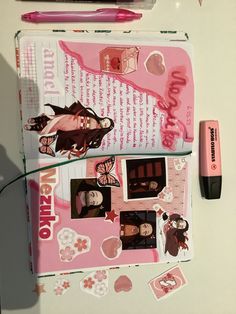 the contents of a pink and white notebook with various stickers on it next to a pen