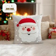 a christmas pillow with a santa clause on it