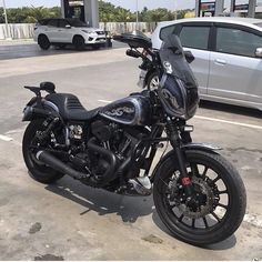 a black motorcycle parked in a parking lot