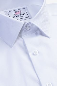 Our take on a classic workweek uniform–the Ultimate Essentials pack contains three of our white Aiden dress shirts, each with a different collar style (cutaway, spread and point). 
Aiden’s features:
Flat-felled seams
Reinforced side seam gusset
Double-layered back yoke
Contrasting buttonholes Dress Shirt Photoshoot, Mens White Dress Shirt, Flat Felled Seam, White Dress Shirt, Business Casual Shirts, Slim Fit Dress, Cotton Labels, White Cotton Dress, Slim Fit Dress Shirts