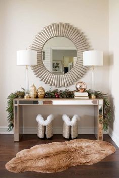 a console table with fur slippers on it and a mirror in the corner behind it