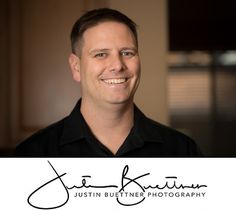 a man is smiling for the camera with his name on it's business card