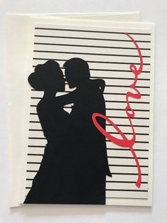 a card with a silhouette of two people hugging each other and the words love on it