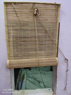 a window with a bamboo blind on it