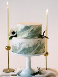 a three tiered cake sitting on top of a table