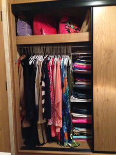 the closet is full of clothes and other items