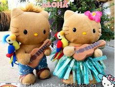 two stuffed animals that are standing next to each other with guitars in front of them