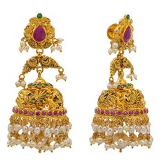 This 22k yellow gold temple jewelry set from Virani is simple breathtaking. The adornments of emeralds, rubies, cz, and pearls used to decorate the engraved details of this 22k gold necklace and Jhumka earring set create a spectacular look of shimmer and richness. This set of Indian gold temple jewelry is ideal for pairing with bridal and other traditional Indian attire to show off one's cultural pride and heritage for special occasions and events. Features • 22k yellow gold • Cubic zirconia • E Temple Necklace, 22k Gold Necklace, Gold Temple Jewellery, Temple Jewelry, Jhumka Earrings, Indian Attire, Temple Jewellery, Traditional Indian, 22k Gold