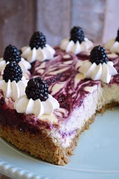 a piece of cheesecake with berries and whipped cream on top