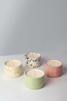 three candles sitting next to each other on a table