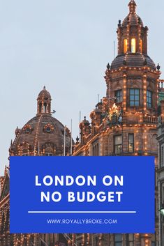 the london no budget sign is lit up in front of an ornate building with lights on it