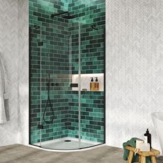 a green tiled bathroom with a walk in shower