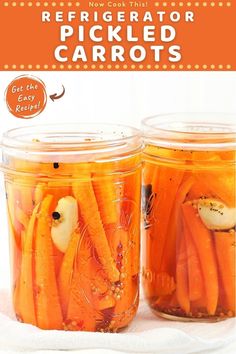 two jars filled with pickled carrots on top of a table