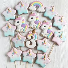 unicorn cookies and cupcakes are arranged in the shape of numbers