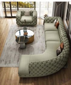 a living room filled with lots of furniture and a glass table on top of a hard wood floor