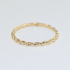 14k Solid Gold Dainty Twist Ring. Real Gold Stackable Twist Band. Elegant Wedding Band. Premium Fine Jewelry For Her.  💙 Our jewelry is handcrafted with love and great care at San Francisco Bay! All of our items are 14k stamped for authenticity. 💙 You will receive them exactly as pictured. We don't use any filters, all photos are authentic and unedited.  💙 Band Width is 1.40 mm. 💙 We're offering the finest quality in solid gold jewelry. 💙 Quick shipping - Your order will be handcrafted and 14k Stamped Hoop Jewelry For Wedding, Gold Hoop Wedding Rings, Stackable Hoop Jewelry For Wedding, Stackable Hoop Wedding Jewelry, 14k Gold Band Jewelry For Wedding, Yellow Gold Band Promise Ring, Dainty Wedding Band, Alexandrite Jewelry, Twisted Band Ring