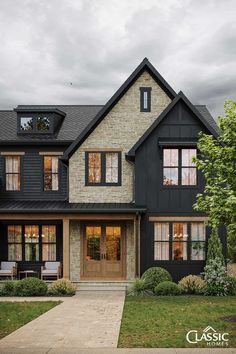 a black and white house with lots of windows