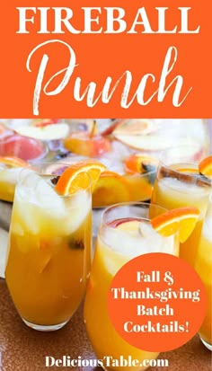 two glasses of fireball punch with orange slices on the rim and text overlay that reads, fall & thanksgiving batch cocktails delicious table com